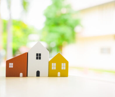 Wood house model on wood table , a symbol for construction , ecology, loan, mortgage, property or home.
