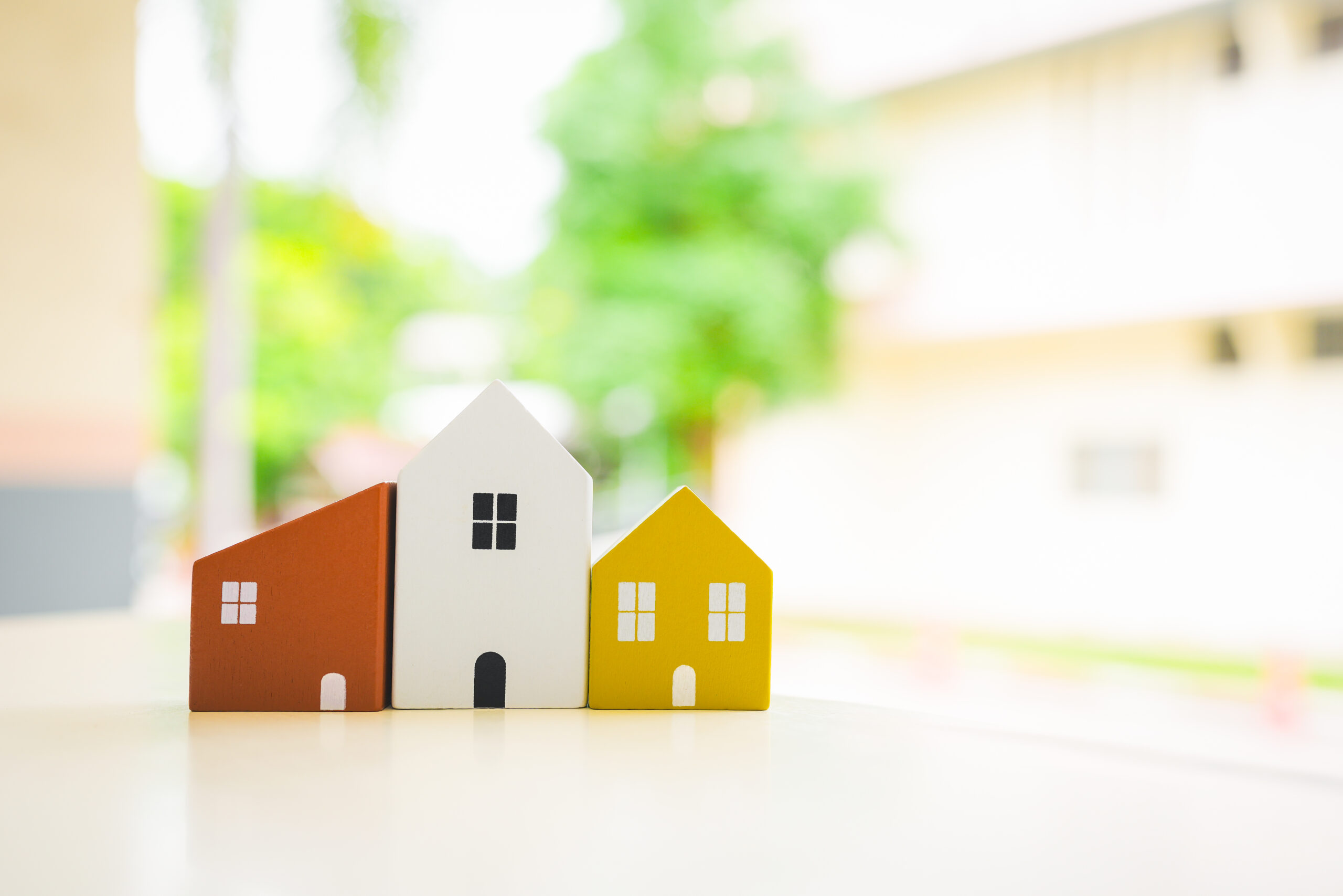 Wood house model on wood table , a symbol for construction , ecology, loan, mortgage, property or home. Wood house model on wood table , a symbol for construction , ecology, loan, mortgage, property or home.