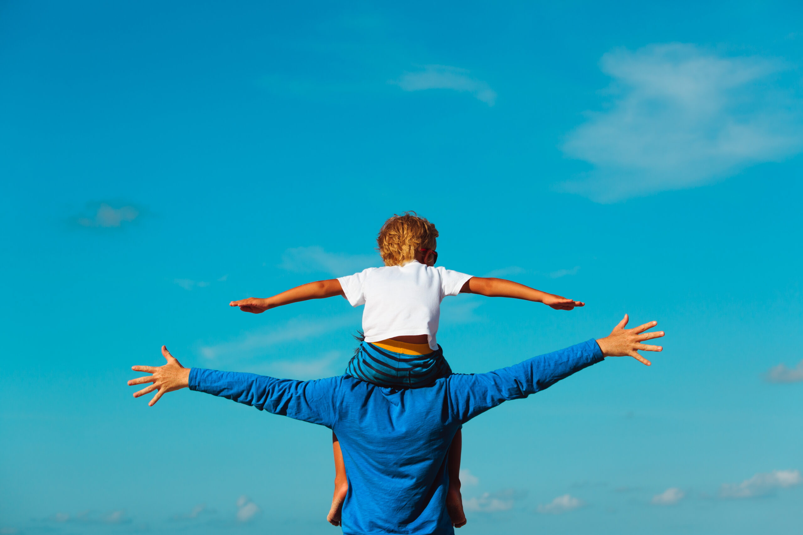 father and son having fun on sky father and son having fun on sky